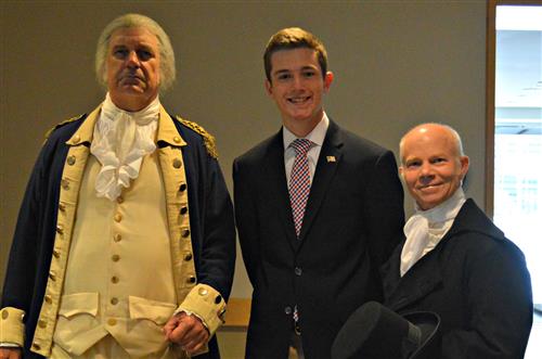 Danny Coyle poses with "George Washington" and "James Madison" 